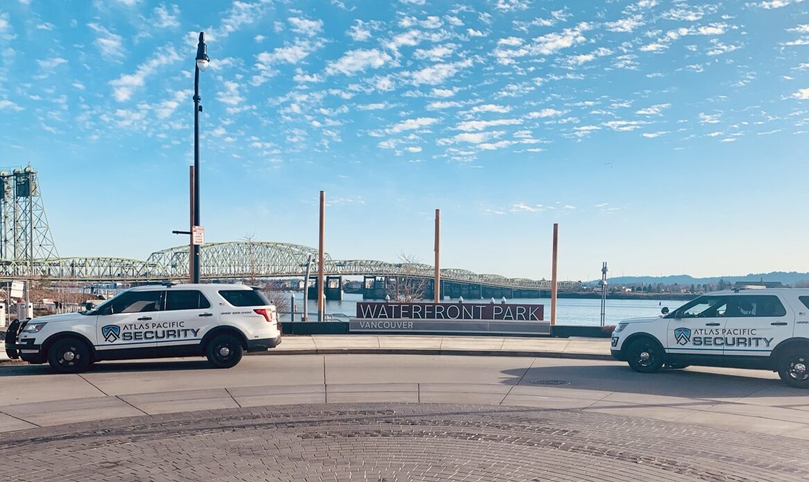 Atlas Pacific Security patrol cars parked in front of a bridge at Waterfront Park